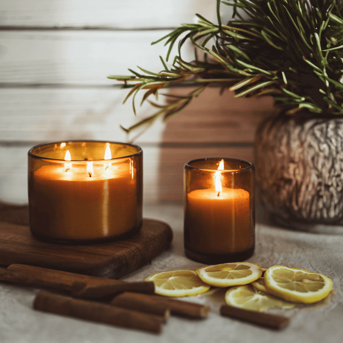 bluecorn beeswax candles scented with essential oils in blown glass candle holders