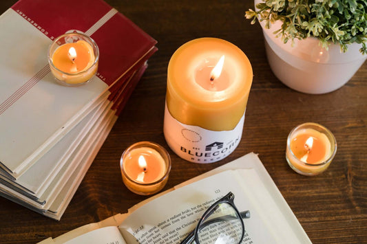 candles from beeswax tea lights pillars and book with glasses bluecorn candles