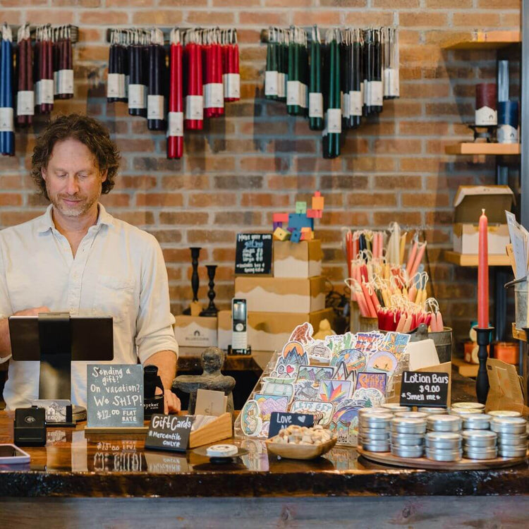 bluecorn candles founder jon kornbluh at work in the bluecorn mercantile in montrose before our hand-dipped pure beeswax tapers