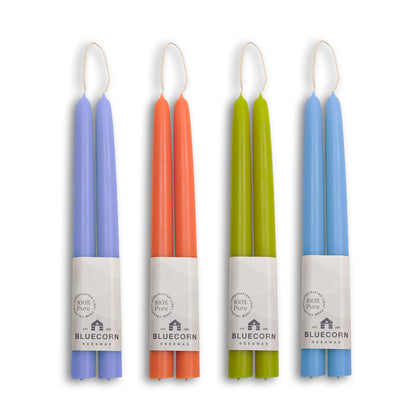 Summer beeswax taper candles bundle in lilac, apricot, pistachio, and sky blue colors.