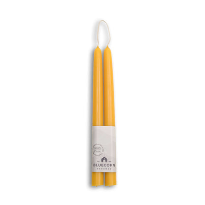 tapered beeswax candles Pure beeswax taper candles from Bluecorn Candles. Pair of 10" long candlesticks. Yellow tapered candles. Natural, non toxic candles.