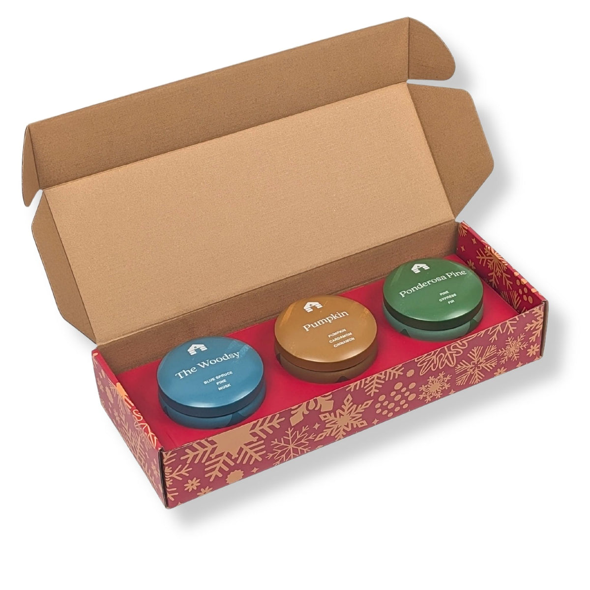 Scented candle gift set featuring three 8oz aromatic candle tins: Pumpkin, Pine, and Woodsy in a festive box.