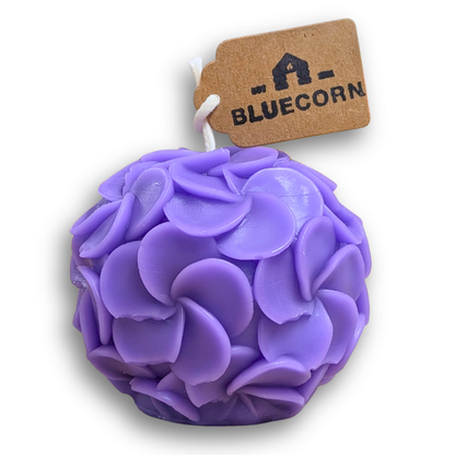 Hydrangea shaped candle made of beeswax in purple, featuring a clustered petal design, perfect for modern decor.
