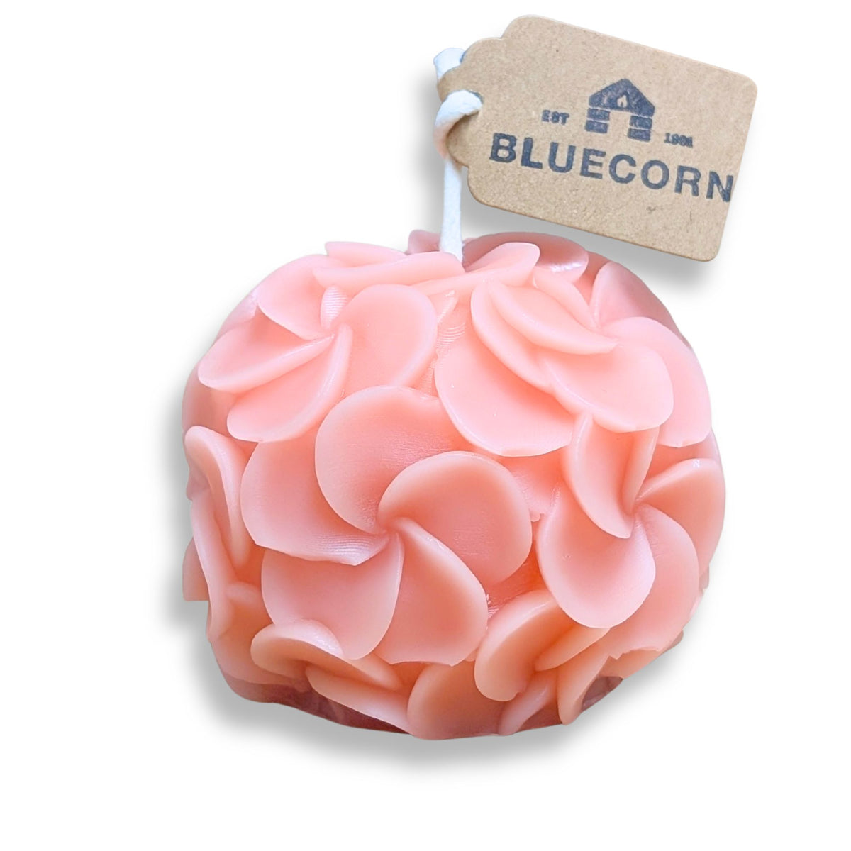 Hydrangea shaped candle featuring pinwheel petals in soft pink color, complementing modern decor.
