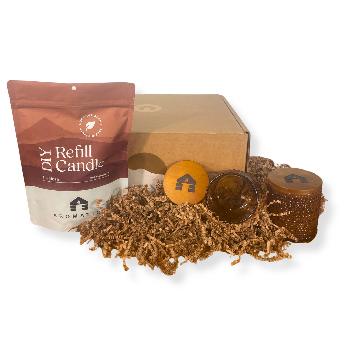 DIY refill candle kit with packaging and materials on a white background