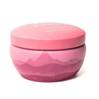 The side of a Bluecorn Aromática 8oz Paloma scented candle tin with white background