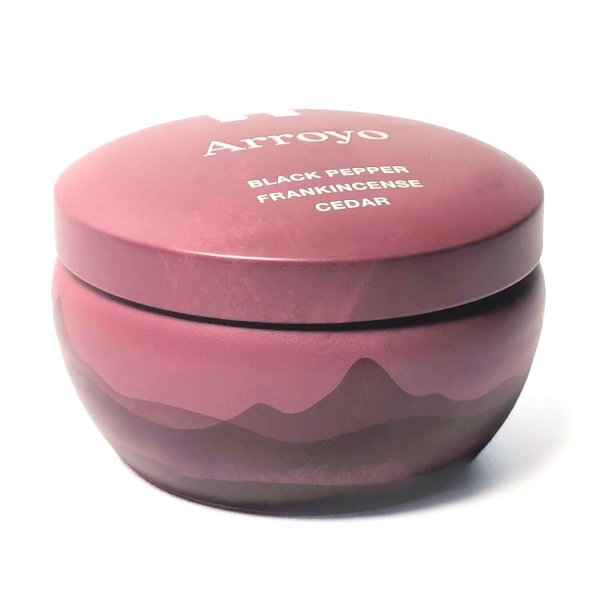 The side of a Bluecorn Aromática 8oz Arroyo scented candle tin with white background