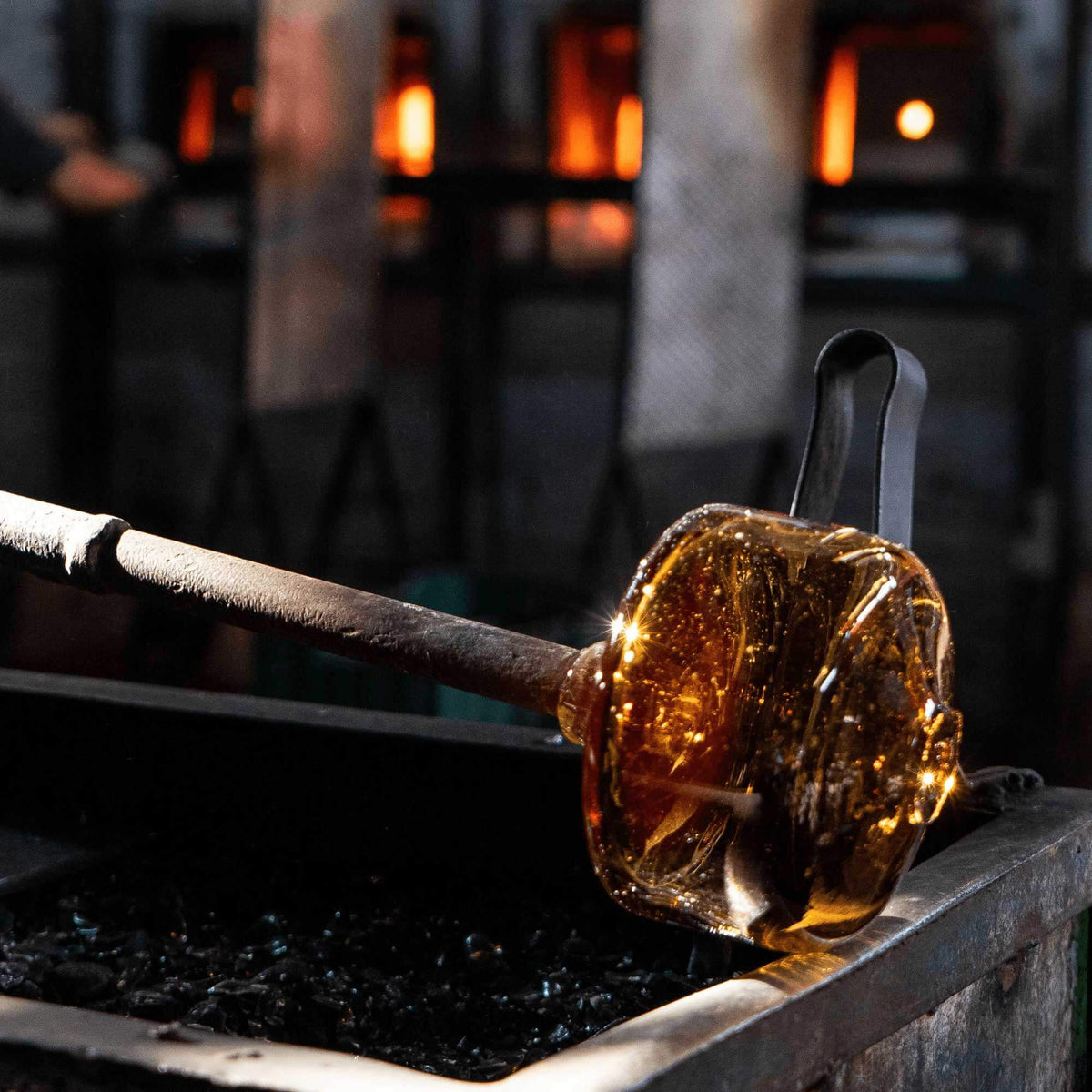 blown glass candle holders being crafted for bluecorn