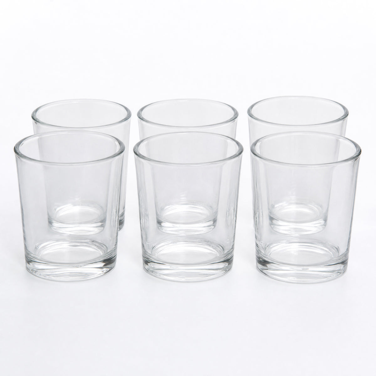 A 6-pack of Bluecorn beeswax clear votive candle holder