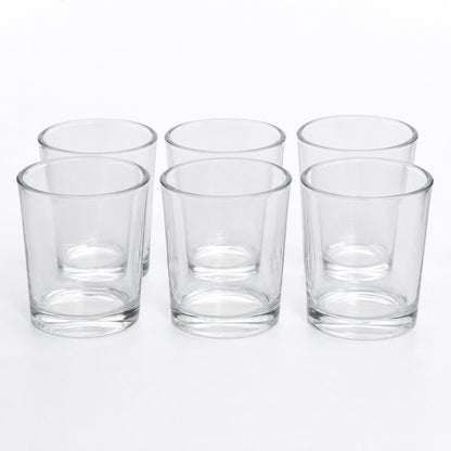 A 6-pack of Bluecorn beeswax clear votive candle holder