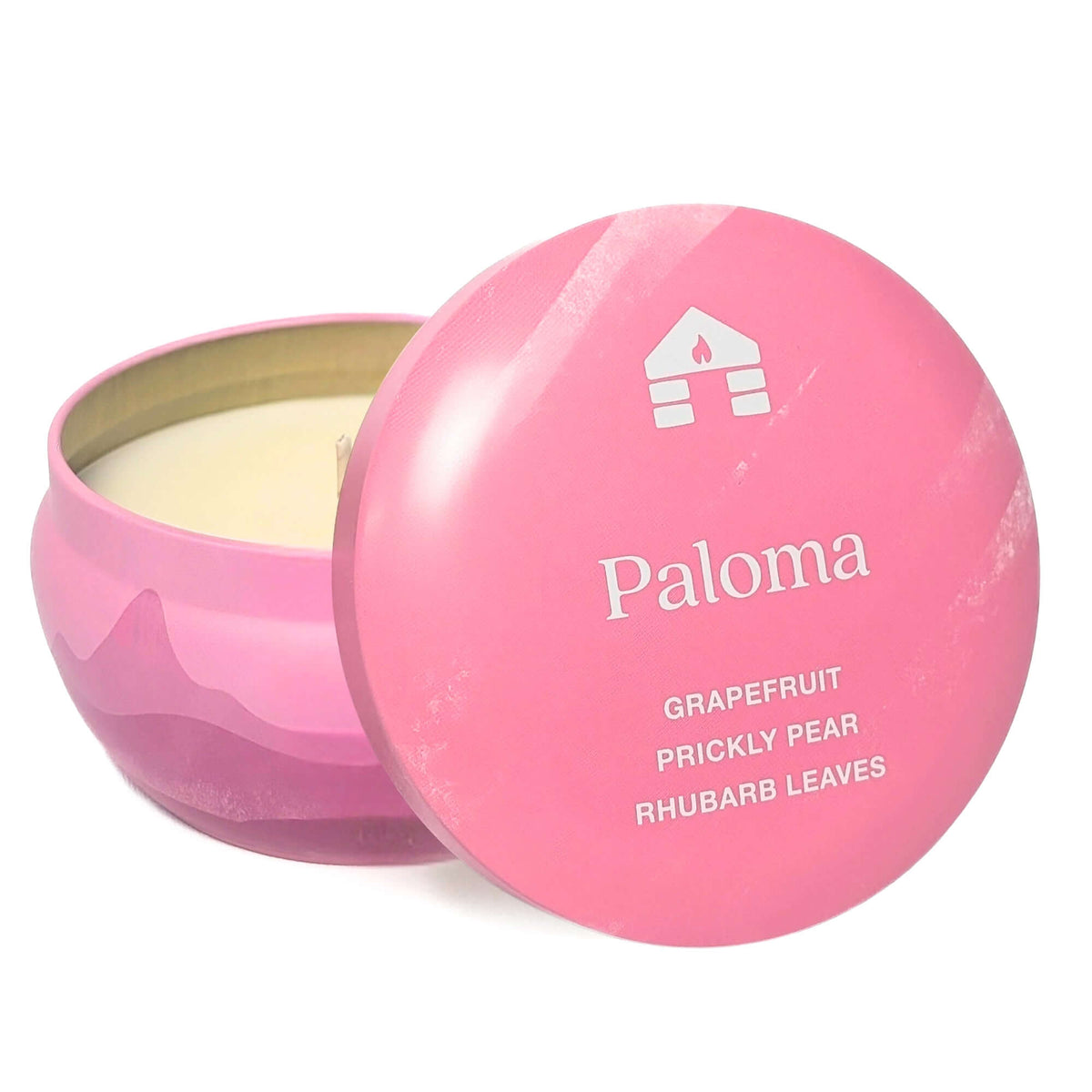 A Bluecorn Aromática 8oz Paloma scented candle tin with the lid taken off showing the wax with white background