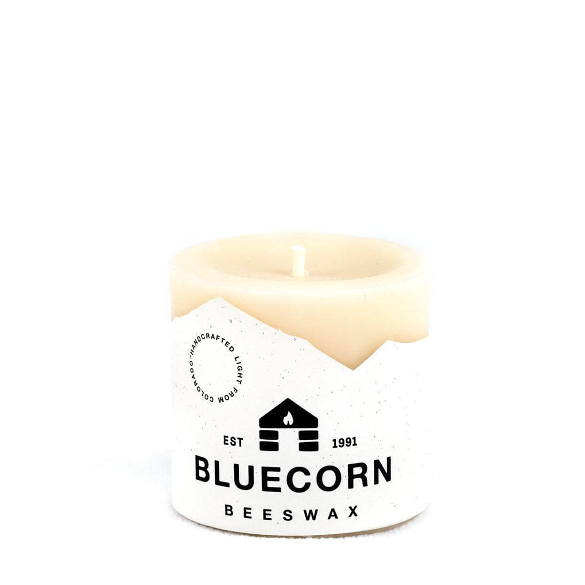 Bluecorn Beeswax 100% Pure Beeswax 3" x 3" Ivory Pillar Candle. Burn Time: 50 hours. Made with 100% Pure Beeswax, is white in color. Made with 100% pure cotton wick, no lead and paraffin free. Clean burning and non-toxic. Features Bluecorn Beeswax label printed on 100% recycled paper.