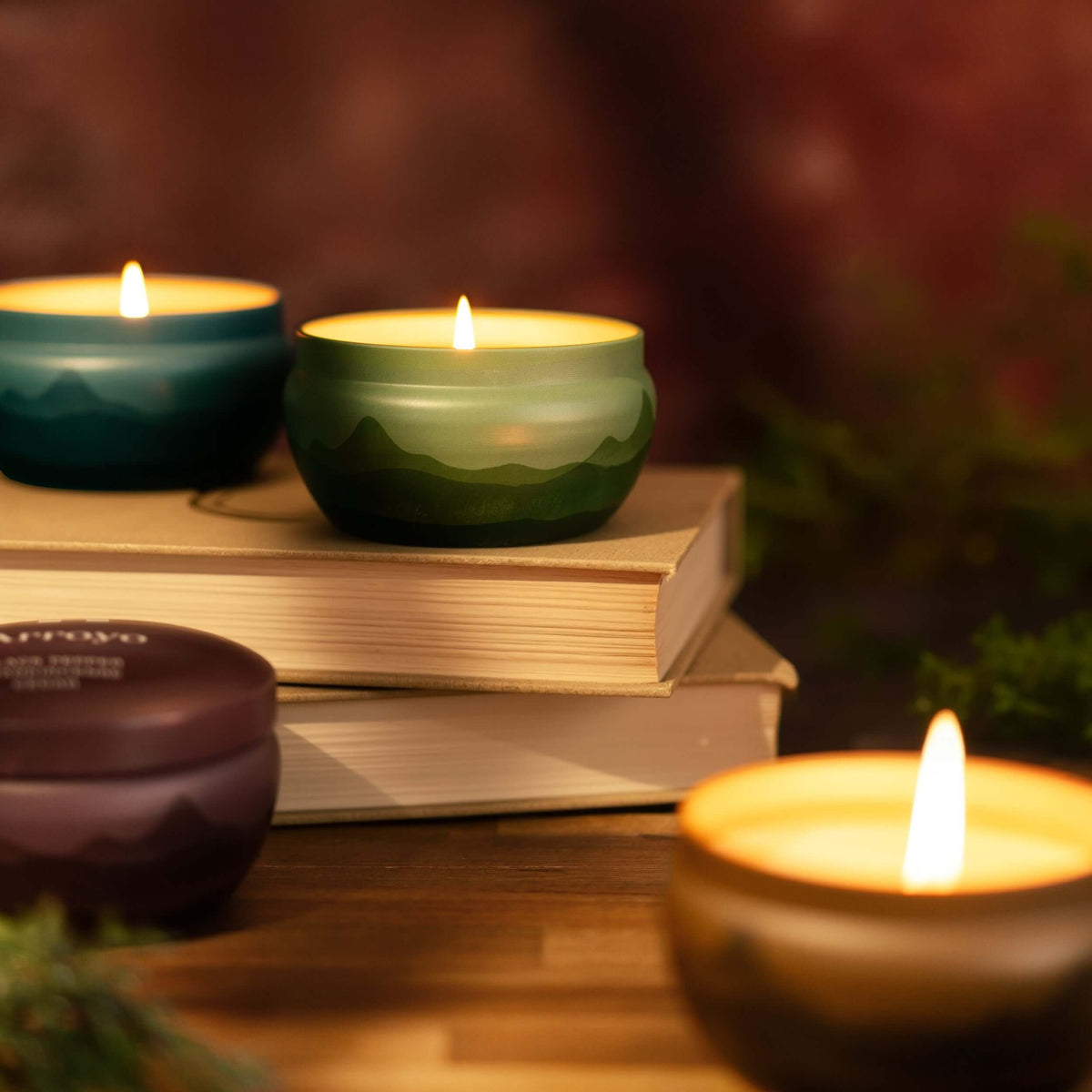 scented candle tins with mountain range design variety of colors bluecorn
