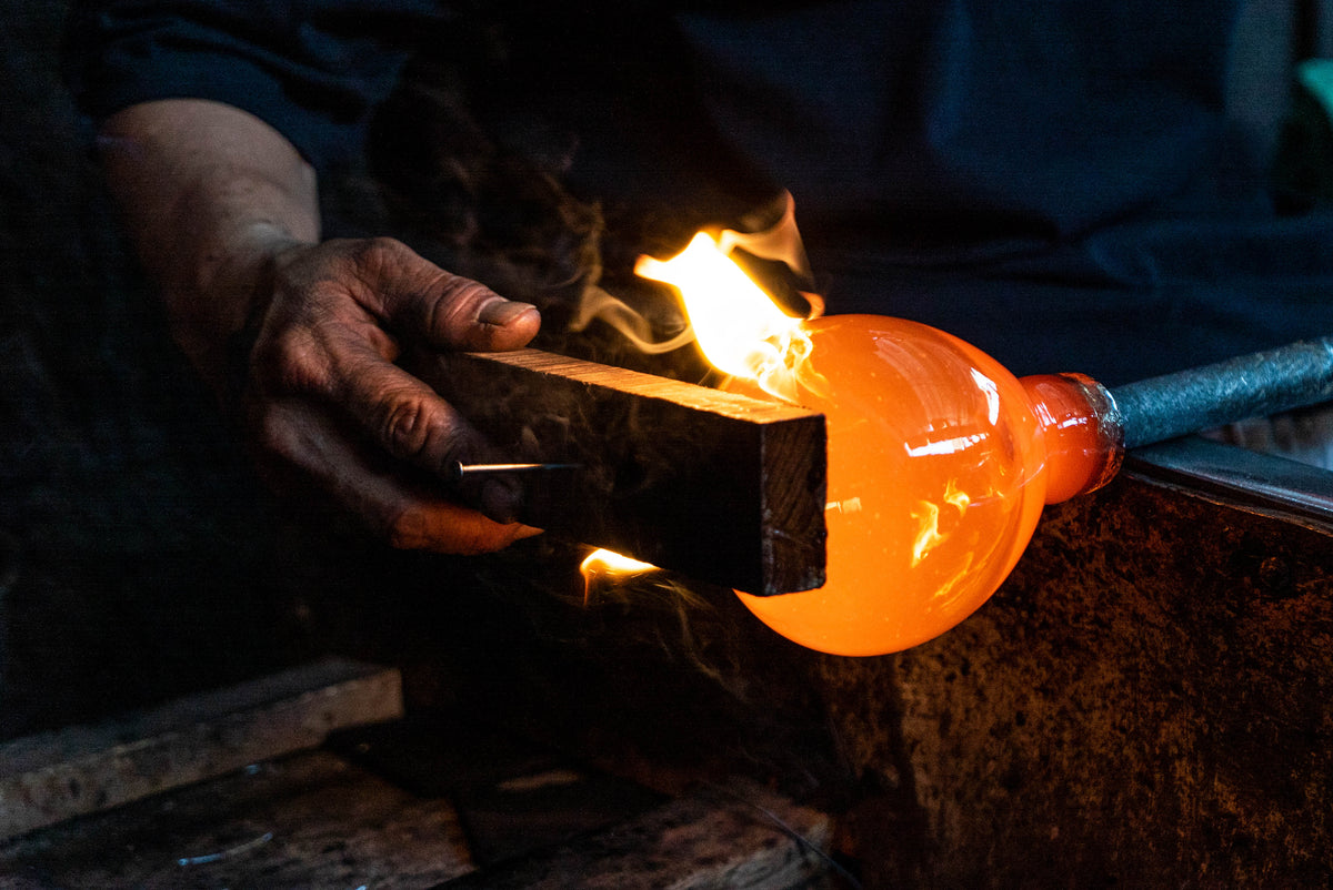Load video: A video that demonstrates the artisanal glass blowing process of Bluecorn Botanica blown glass candle holders
